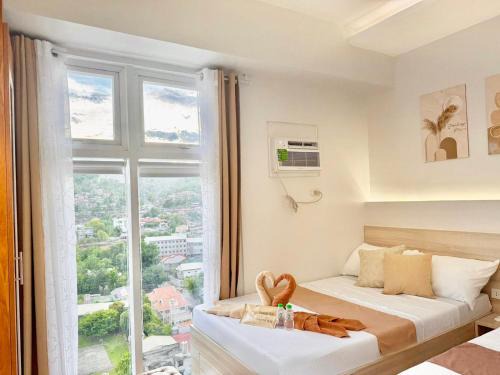 Tranquil Mountain View in Cebu City Studio unit for 1 to 4 pax with High speed WiFi Free Pool and Netflix