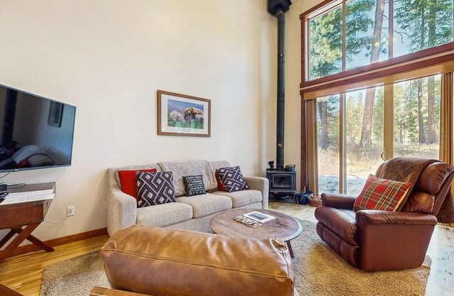 Tree-lined home with forest views & wood stove - right on the golf course