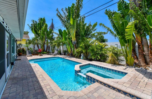 Tropical 4 Bed Pool Home Min to Beaches! Available Now
