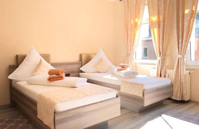 Twin room with shared bathroom