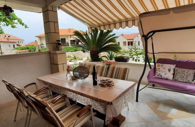 Two bedroom apartment with terrace Postira, Brač (A-12291-b)