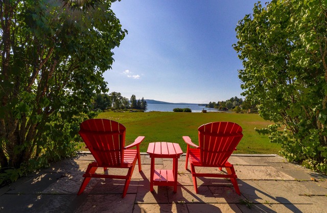 Two lakefront dog-friendly cabins on four acres with porches, dock, & lake views