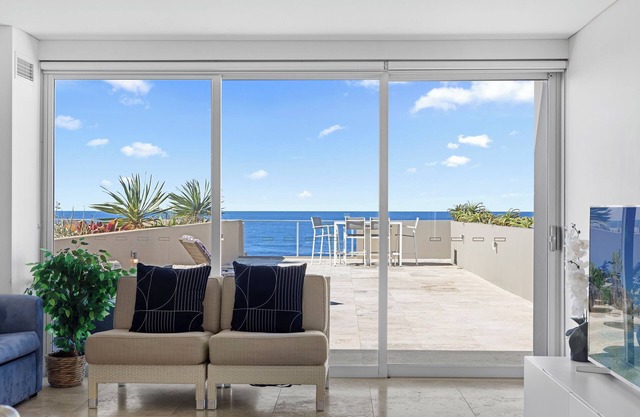 Two Level Beachfront Apartment. Uninterrupted Ocean View and Rooftop Terrace.