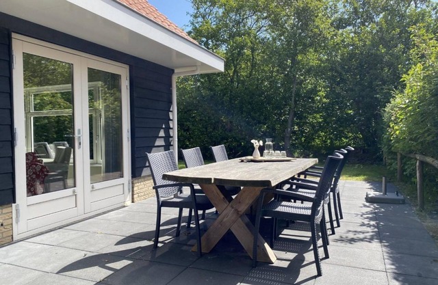 Two luxury holiday homes near the golf course, the village Hollum and nature.
