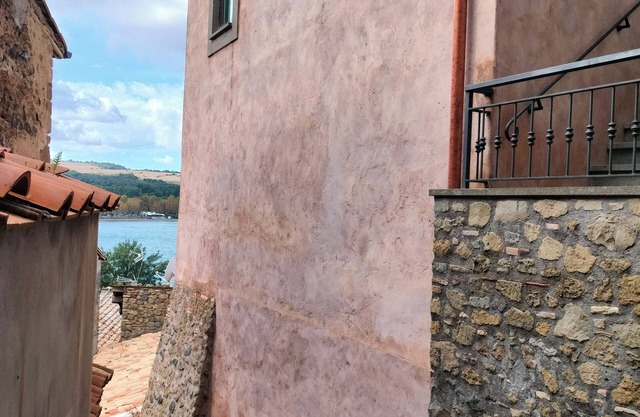 Two-room apartment located in private area of the village with exclusive terrace overlooking the lake