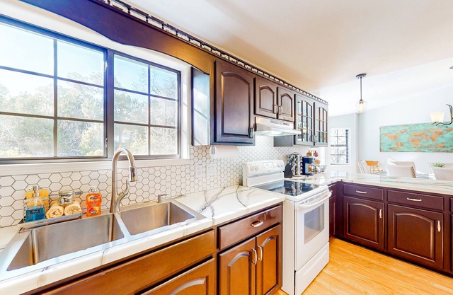 Two-story home with large deck, private bbq grill, and scenic views
