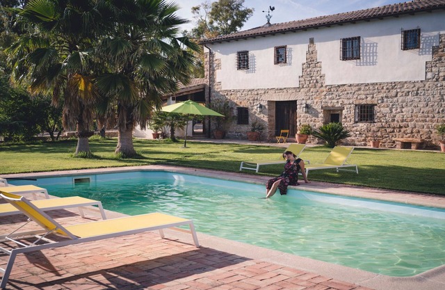 Typical Andalusian farmhouse surrounded by olive and fruit trees