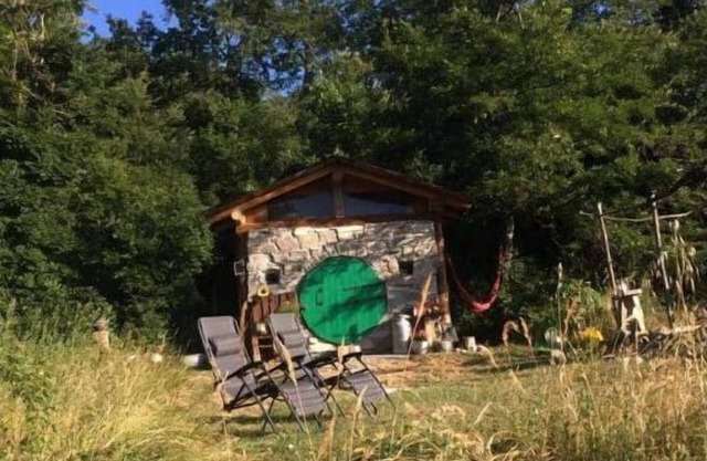 Unique offgrid forest cabin, hand built using recycled materials.