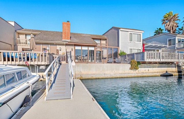 Unique & sleek dog-friendly two-level home w/water views, pool table & dock
