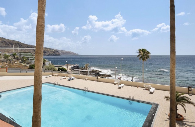 Vacation Apartment 'Arenitas Sunset 1' with Sea View, Shared Pool and Wi-Fi