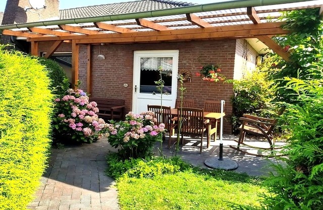 Vacation apartment by the swimming pool with terrace and garden