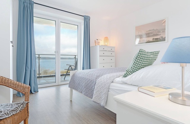 Vacation apartment Maräne in Haus Seeblick with balcony and lake view in Bosau