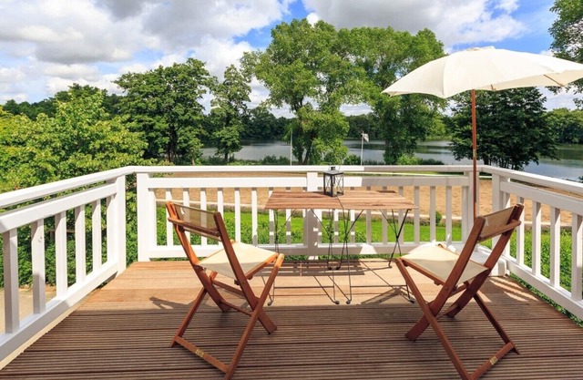 Vacation apartment "Zum See": Direct view of the lake and the dressage arena