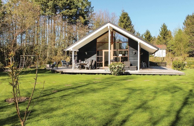 Very well maintained vacation home with large wooden terrace and beautiful garden.
