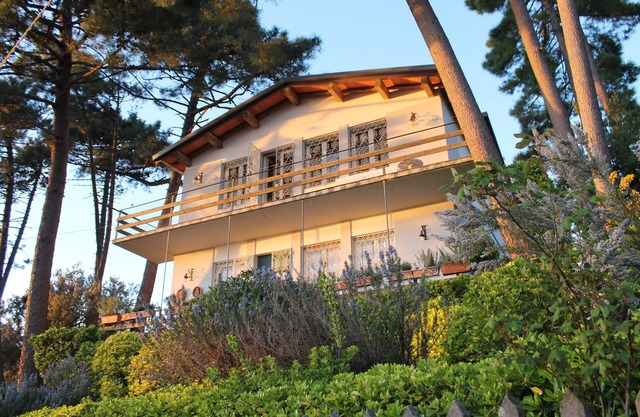 Villa surrounded by green woods, with a wonderful view on the coast. FREE WIFI