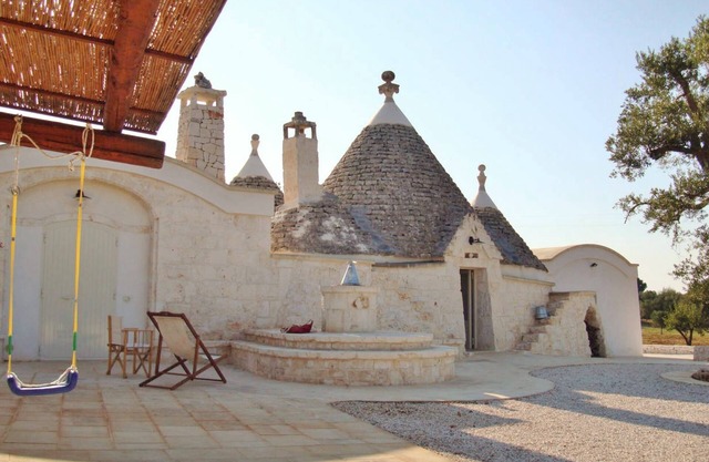 Villa of 4 conical roofs (trullo), fully renovated in big property. Sea view