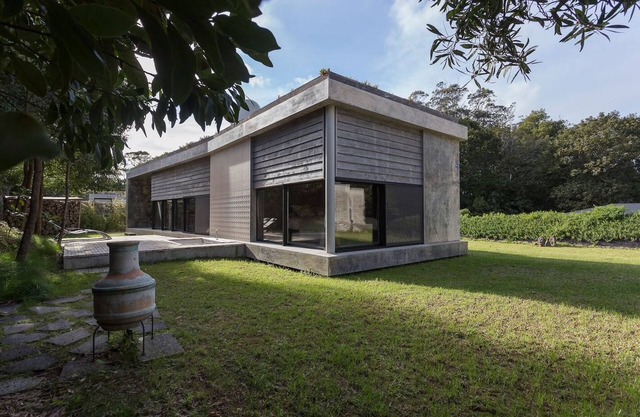 Villa with modern minimalist architecture in the middle of a nature reserve