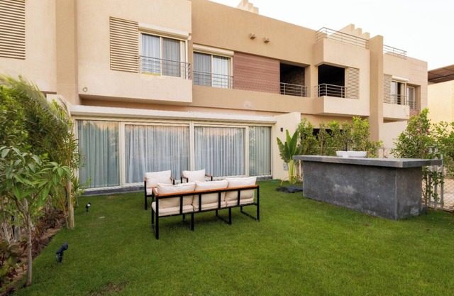 villa with private garden in the crown palm hills compound -sheikh zayed