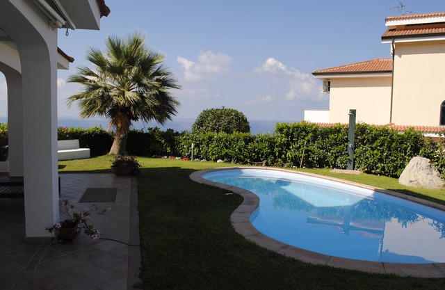 Villa with private pool terrace overlooking the sea, village and beach nearby