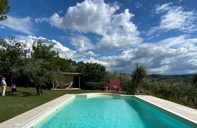 Villa with swimming pool among olive groves and vineyards