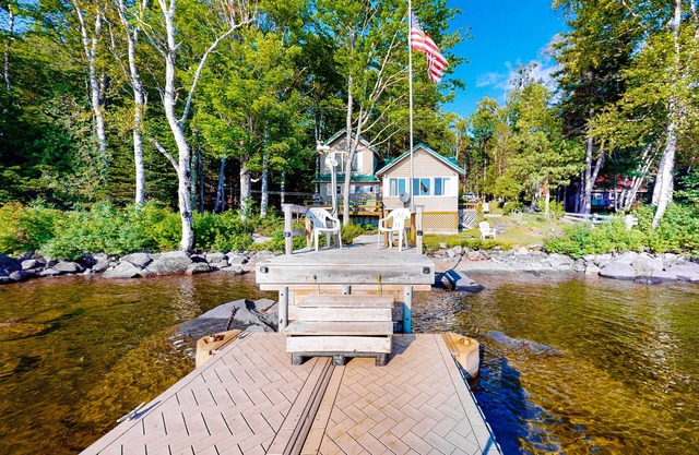 Vintage lakefront cabin with incredible water views, private dock & pebble beach