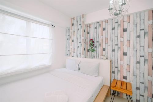 Warm and Cozy 2BR at Low Floor Bassura City Apartment By Travelio