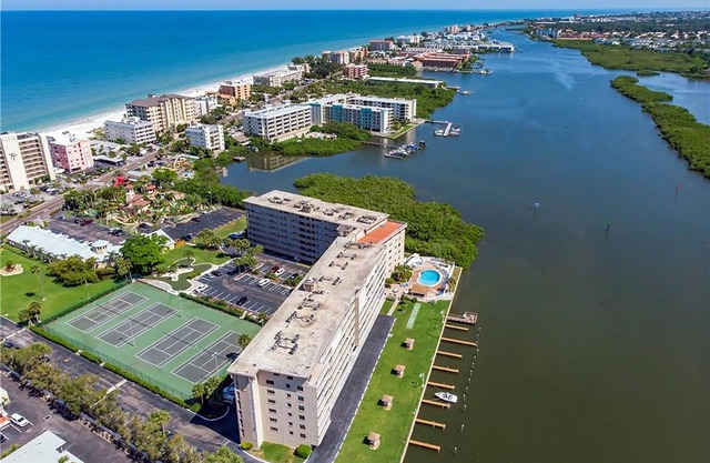 Watch the Boats Go By and Dolphins Play!