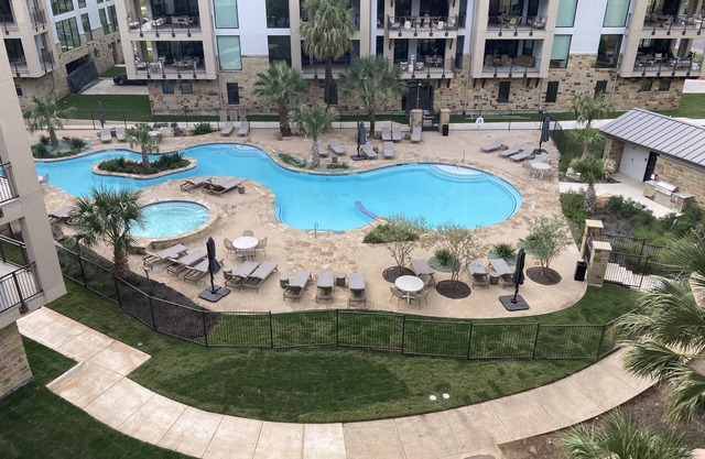 Water-view condo with balcony, smart TVs, Washer/Dryer and Pool