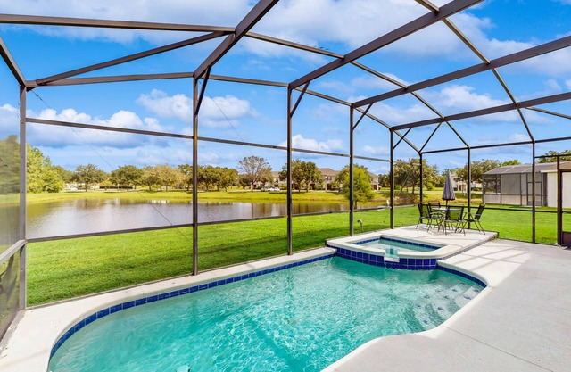 Water view retreat with lanai, heated pool, pool spa, game room, & AC