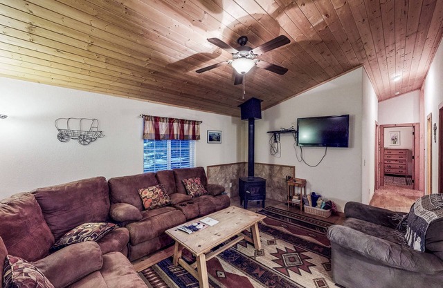 Waterfront cabin with mountain view, wood stove, private hot tub, & WiFi