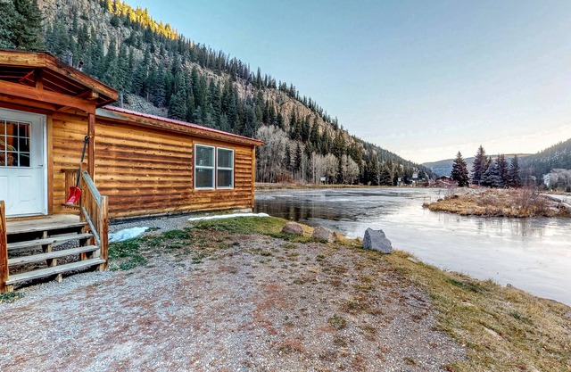 Waterfront cabin with private hot tub, furnished deck, wood stove, & free WiFi