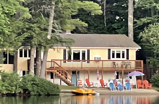 Waterfront home with private sandy beach & large U dock.