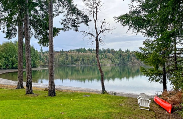 Waterfront home with private hot tub, patio, games, & gym room