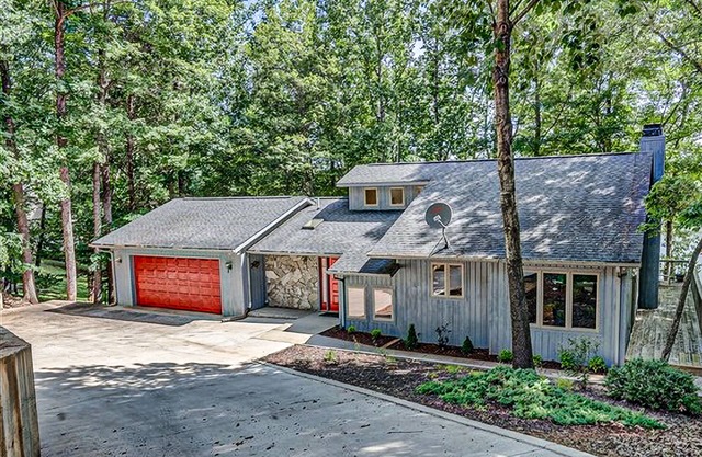 Waterfront home with private dock, lake views, kayaks, paddleboat, & pool table
