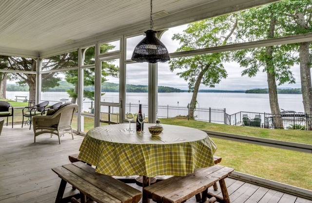 Waterfront home with boat dock, screened-in porch, large deck