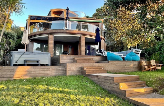 Waterfront paradise with stunning views, spa pool, and paddle boarding.