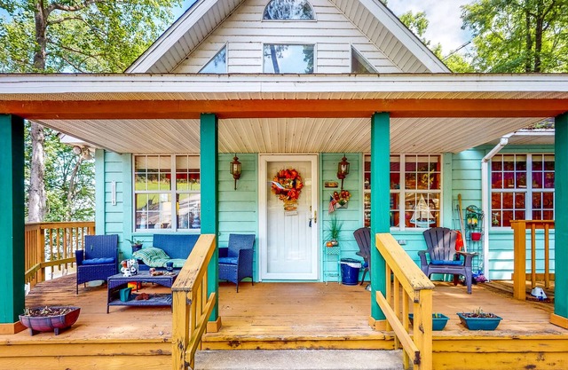Waterfront stay with boat launch, private beach, wrap-around deck, & grill
