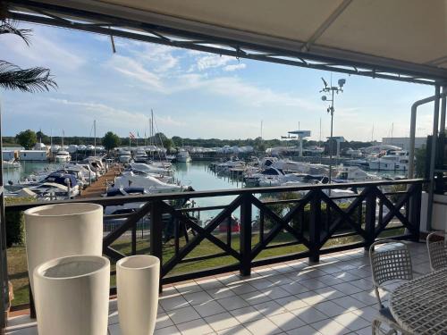 Welc-ōM Lignano swim and fun with dock view