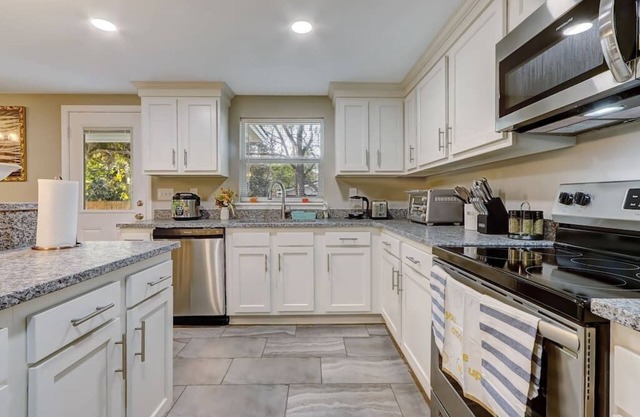 Welcome to Merival Manor! Fresh & New find your way to this spacious hideaway