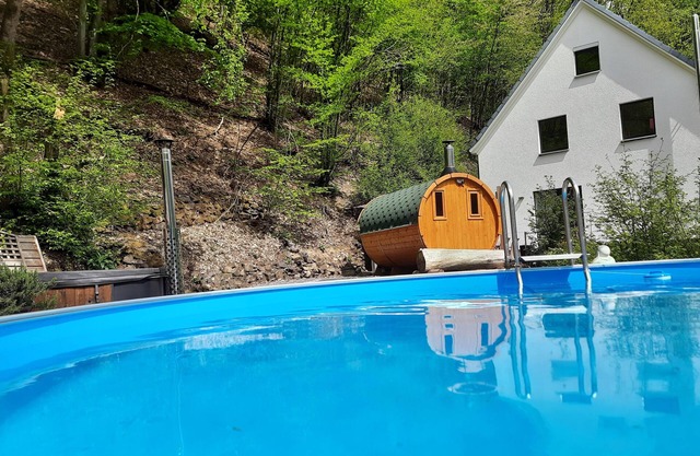 Wellness holiday home with a covered pool, hot tub and barrel sauna in the Rosbachtal
