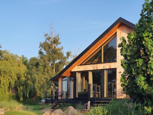 WerderChalet - MEER IN SICHT - Meerblick I Strand 150m I Sauna I eKamin I bis 5 Pers I by "Meyers am Meer"