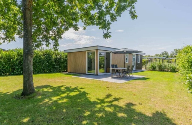 What immediately catches your eye upon entering is the garden-oriented living room with open kitchen