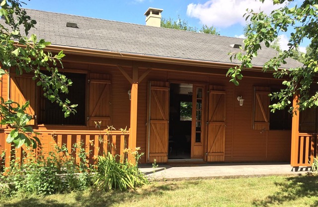 WOOD FRAME HOUSE WITH TERRACE AND LAND TREES