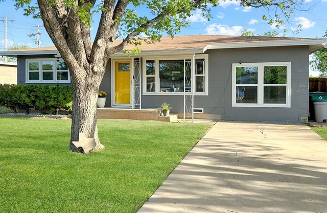 Yellow Texas Star House next to Goodfellow AFB