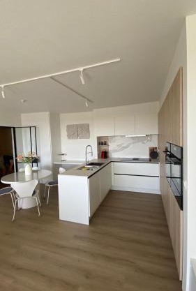 Zuidgericht appartement met wijd uitzicht - Met privégarage