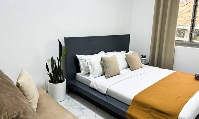 Entebbe Hotel | 2 Bedroom Apartment w/Palm View Balcony Ensuite Bathrooms Entebbe