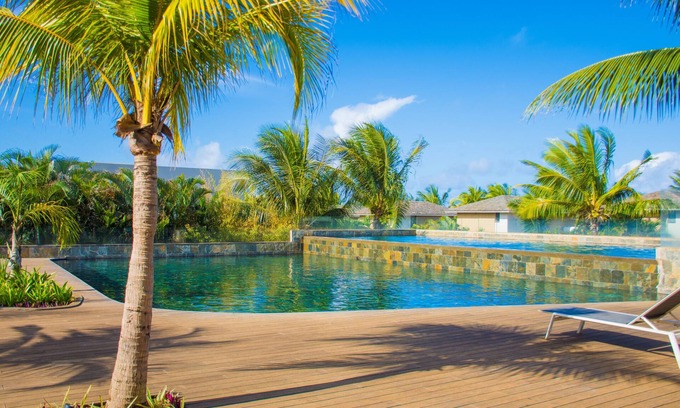 Roches Noires Hotel | Azuri Apartment with Beach, Pools, Gym, Restaurants, Spa, Boats, kids Corner