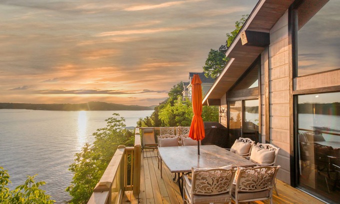 Osage Beach House | Beautiful lake front sunset view, you can hear waves crashing against the bluff