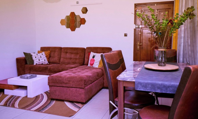 Yaounde Apartment | Bright, cozy apartment, where mustard yellow creates a warm ambience.