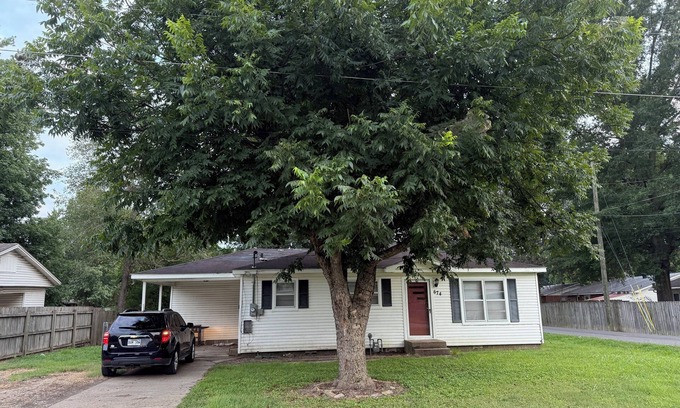 Piggott House | Cozy 3-Bedroom Cottage with Carport & Shaded Yard. Nestled under a big tree.